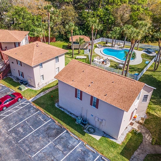addiction treatment | Real Recovery Sober Living Bradenton Property Overview Sober and Recovery Apartments for Men Aerial with pool